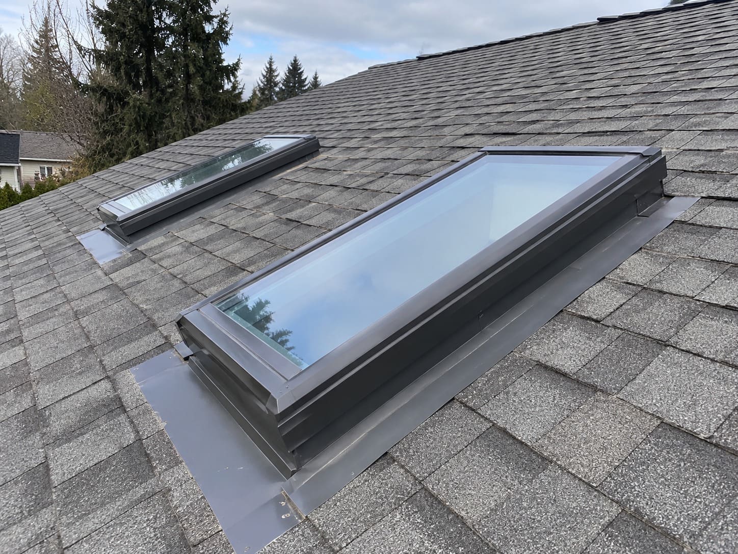 Skylight maintenance on a roof in Gresham, Oregon